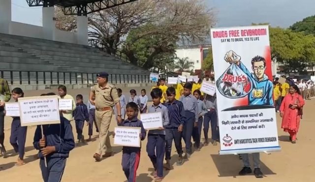 Doon Police holding small hands and taking them away from beggary towards education