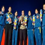 Women rafters of Real Adventure waved the flag