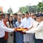 Soldier Welfare Minister Ganesh Joshi collecting soil from the courtyard of martyr Lieutenant Pratik Acharya under Shaheed Samman Yatra 2.0