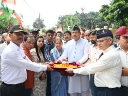 Soldier Welfare Minister Ganesh Joshi collecting soil from the courtyard of martyr Lieutenant Pratik Acharya under Shaheed Samman Yatra 2.0