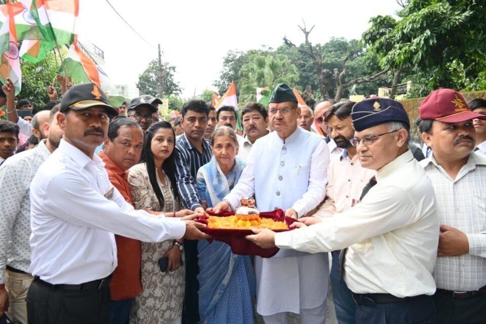 Soldier Welfare Minister Ganesh Joshi collecting soil from the courtyard of martyr Lieutenant Pratik Acharya under Shaheed Samman Yatra 2.0