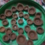 Women made attractive diyas from cow dung.