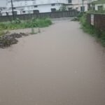 Incomplete construction work has compounded difficulties; due to the Irrigation Department's negligence, rainwater has entered the Haripur area, flooding homes completely.