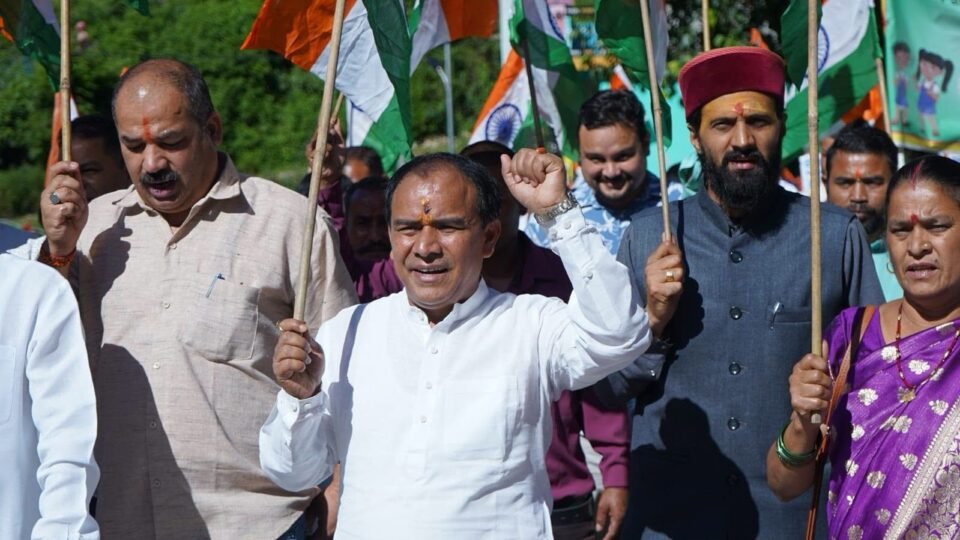 Youth display enthusiasm during the ‘Har Ghar Tiranga’ rally; patriotic slogans raised.